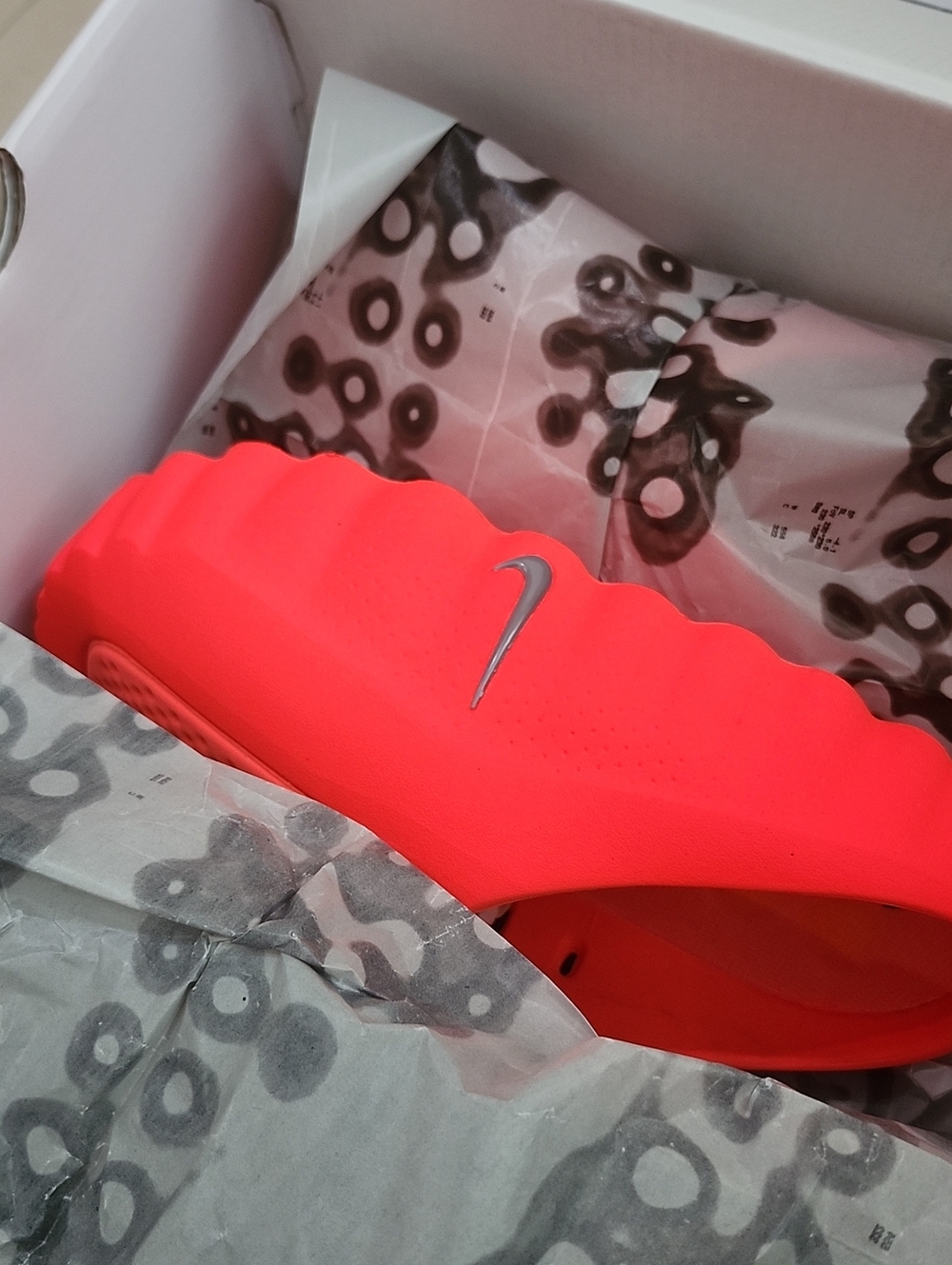 Nike Women’s Neon Coral Slide Sandals with Silver Swoosh